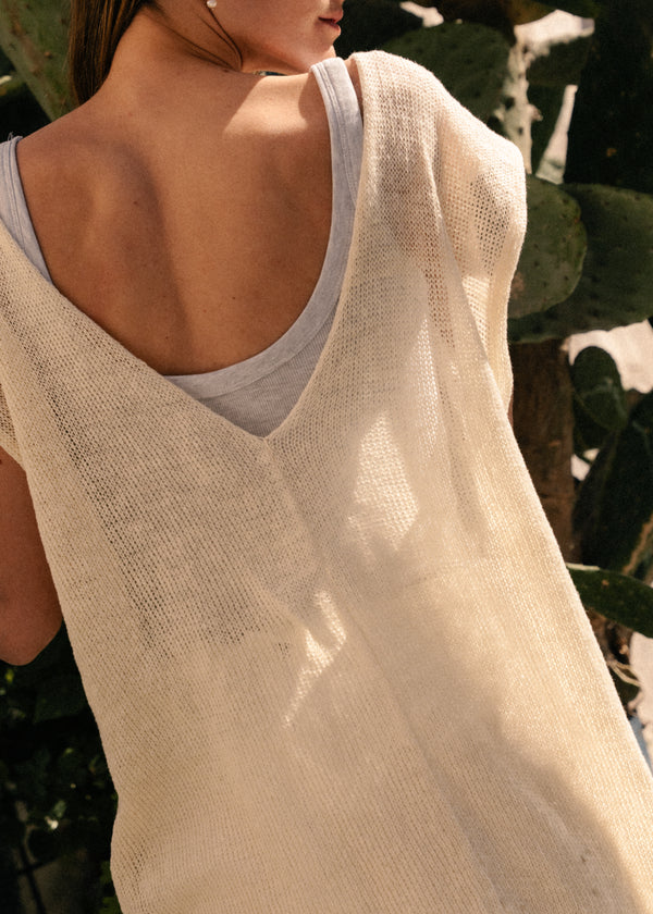Oversized top with one straight side and one V-shaped side