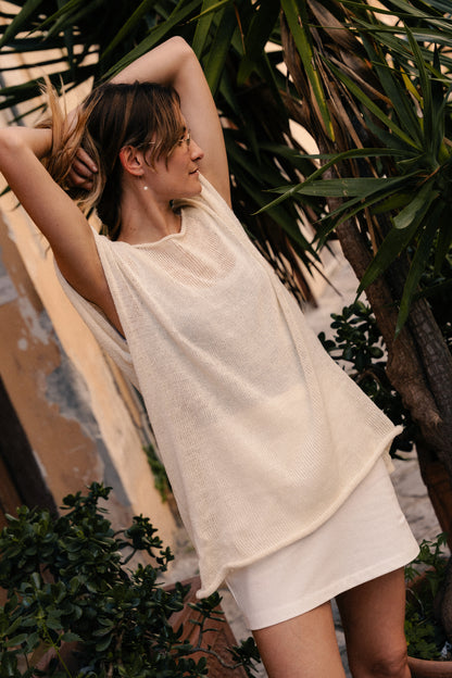 Oversized top with one straight side and one V-shaped side